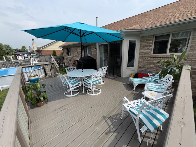 51767 Huntley Ave, New Baltimore, MI 48047 - wooden deck with outdoor dining area and grilling area