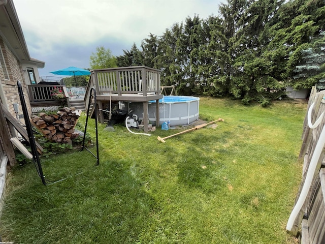 51767 Huntley Ave, New Baltimore, MI 48047 - view of green lawn with a deck and an outdoor pool