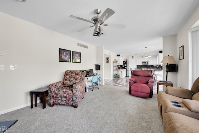 52047 Sycamore Dr, Chesterfield, MI 48047 - carpeted living area featuring ceiling fan and a chandelier
