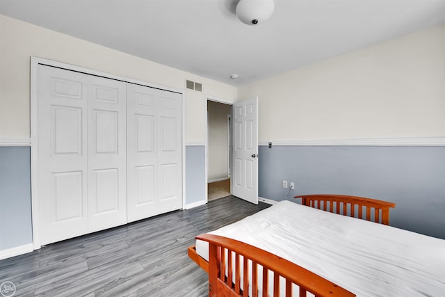 52047 Sycamore Dr, Chesterfield, MI 48047 - bedroom featuring wood finished floors and a closet