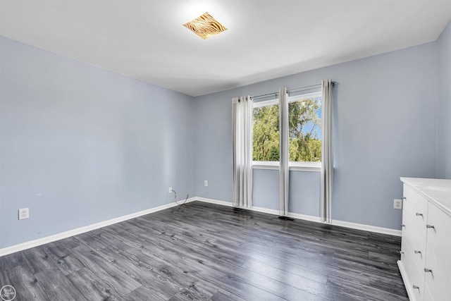 52047 Sycamore Dr, Chesterfield, MI 48047 - spare room featuring dark wood-type flooring