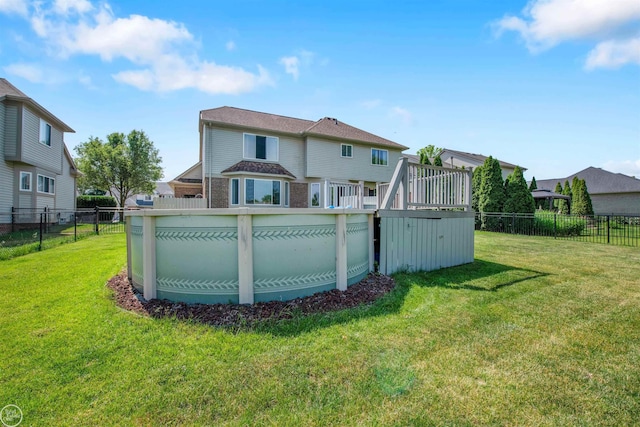 52047 Sycamore Dr, Chesterfield, MI 48047 - rear view of property featuring a fenced backyard, a deck, and brick siding