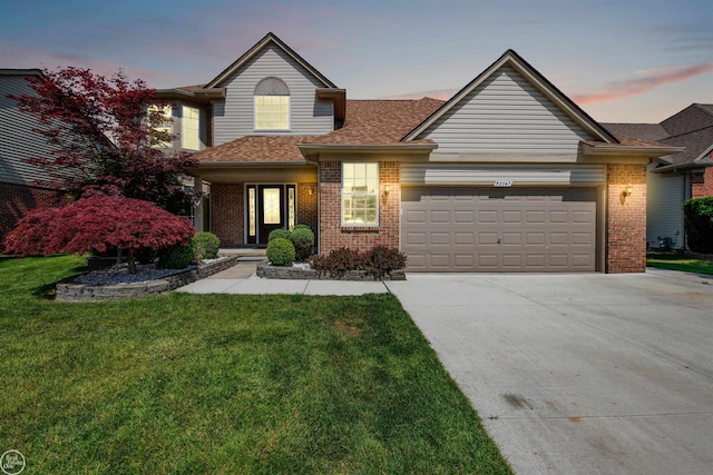 52047 Sycamore Dr, Chesterfield, MI 48047 - traditional home with brick siding, concrete driveway, an attached garage, a lawn, and roof with shingles
