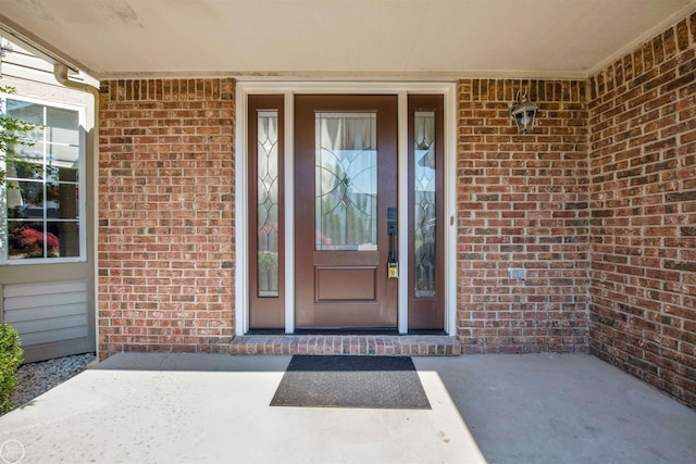 52047 Sycamore Dr, Chesterfield, MI 48047 - doorway to property with brick siding and a porch