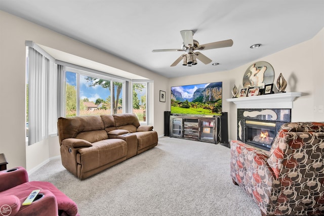 52047 Sycamore Dr, Chesterfield, MI 48047 - carpeted living room featuring a premium fireplace and ceiling fan