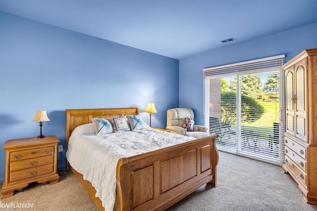45592 Warwick Dr, Macomb Twp, MI 48044 - bedroom with light carpet and access to exterior