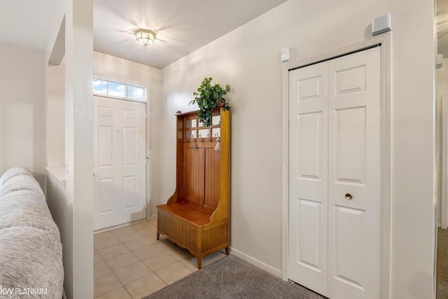45592 Warwick Dr, Macomb Twp, MI 48044 - foyer featuring light tile patterned floors and baseboards
