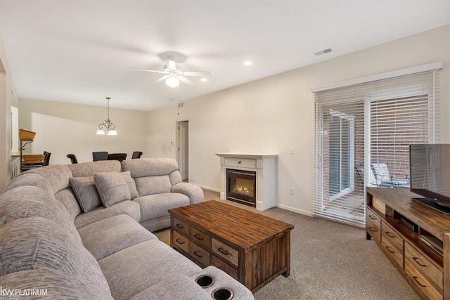 45592 Warwick Dr, Macomb Twp, MI 48044 - carpeted living room featuring ceiling fan, a glass covered fireplace, and recessed lighting