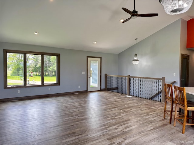 1084 15.5 Rd, Bark River, MI 49807 - empty room with ceiling fan, wood finished floors, recessed lighting, and high vaulted ceiling