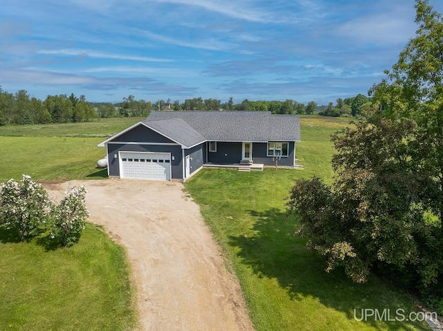 1084 15.5 Rd, Bark River, MI 49807 - single story home with dirt driveway, a front yard, an attached garage, covered porch, and view of wooded area
