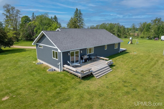 1084 15.5 Rd, Bark River, MI 49807 - rear view of property with a shingled roof, a wooden deck, and a yard
