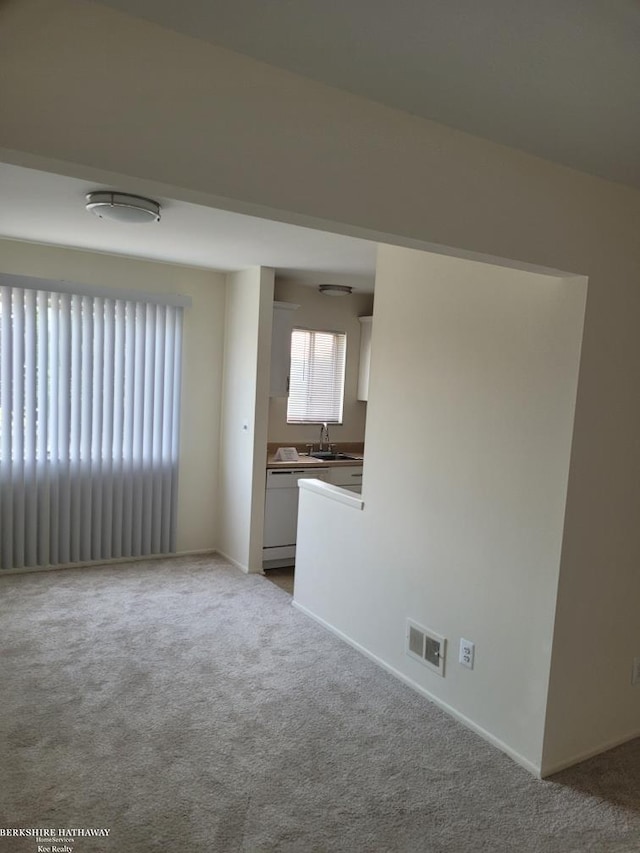 29356 Hoover Rd, Warren, MI 48093 - unfurnished living room featuring a sink and carpet flooring