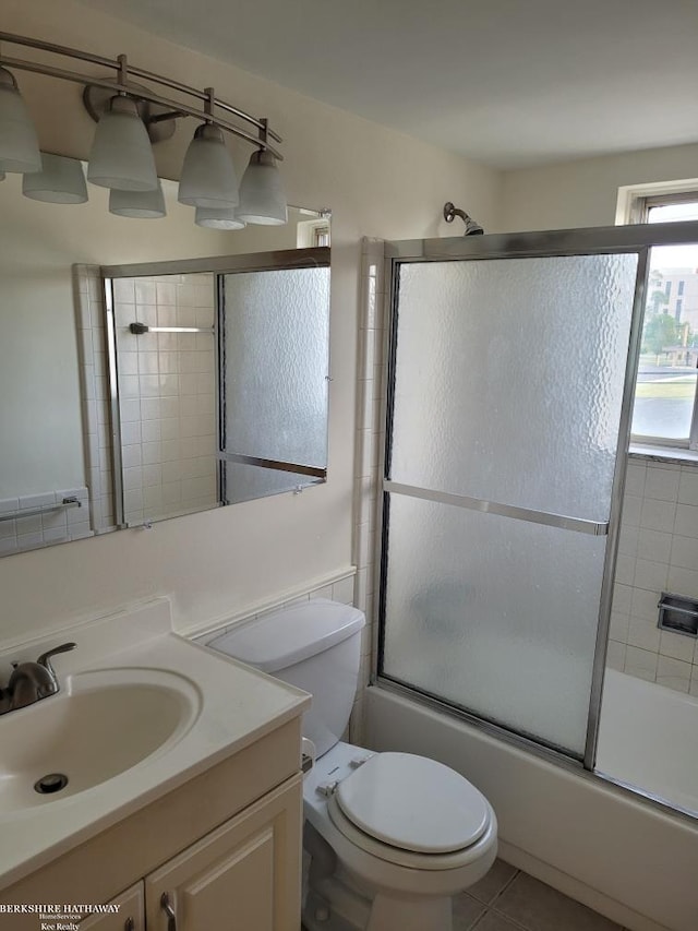 29356 Hoover Rd, Warren, MI 48093 - full bath with vanity, enclosed tub / shower combo, and tile patterned floors