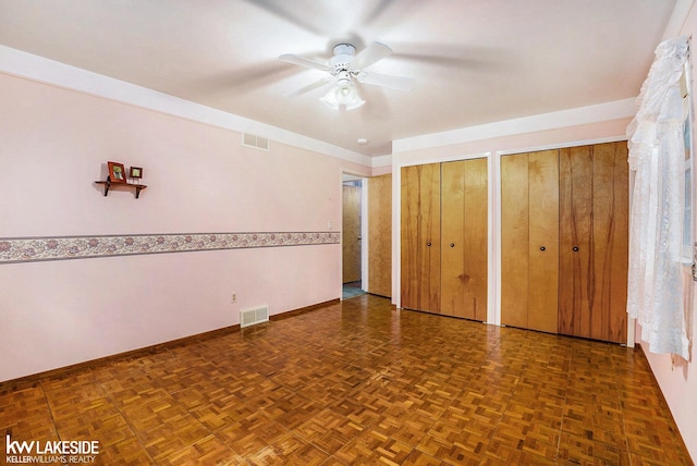 3480 Devonshire St, Sterling Heights, MI 48310 - unfurnished bedroom featuring two closets and ceiling fan