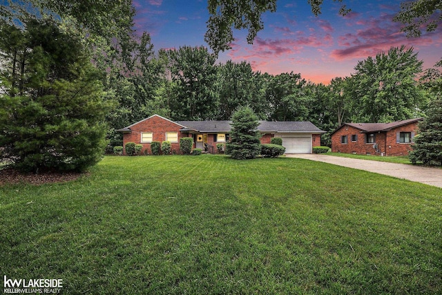 3480 Devonshire St, Sterling Heights, MI 48310 - ranch-style home featuring driveway, an attached garage, a lawn, and brick siding