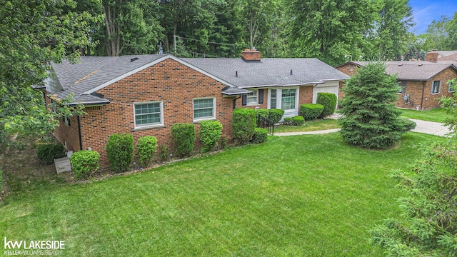 3480 Devonshire St, Sterling Heights, MI 48310 - view of front of property featuring brick siding, a front lawn, a chimney, and roof with shingles