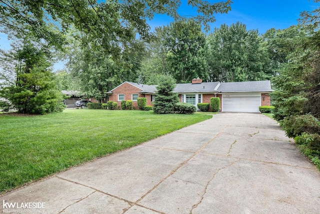 3480 Devonshire St, Sterling Heights, MI 48310 - single story home with brick siding, a garage, driveway, a front lawn, and a chimney