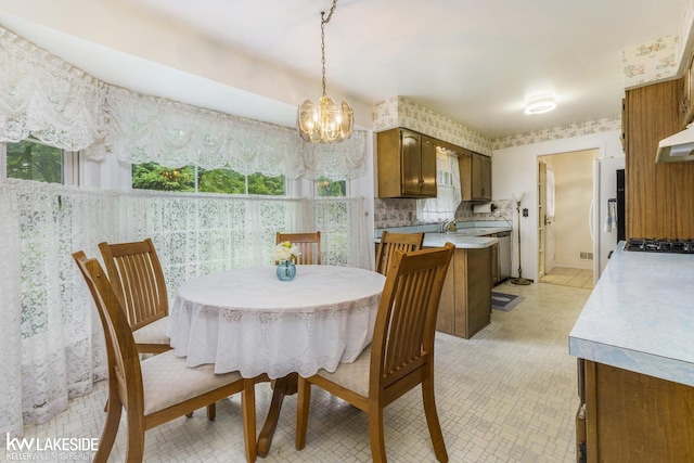 3480 Devonshire St, Sterling Heights, MI 48310 - dining space featuring a chandelier, plenty of natural light, and wallpapered walls