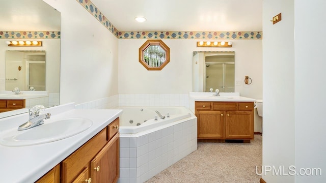 160 N Pyle Dr, Kingsford, MI 49802 - full bath featuring a stall shower, two vanities, and a tub with jets