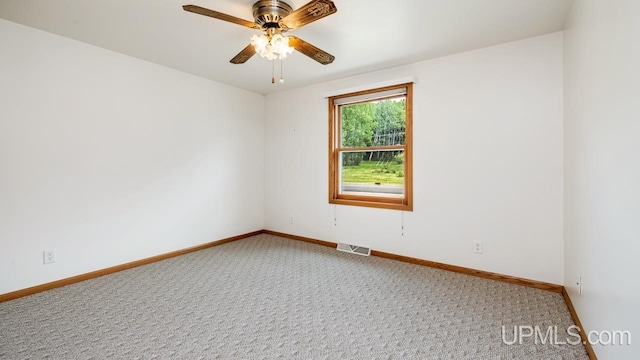 160 N Pyle Dr, Kingsford, MI 49802 - carpeted spare room featuring baseboards and ceiling fan