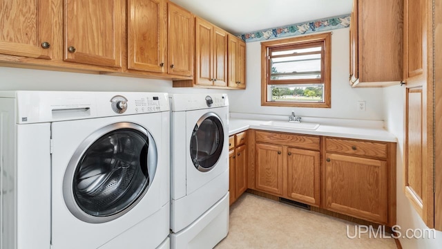 160 N Pyle Dr, Kingsford, MI 49802 - washroom featuring separate washer and dryer and cabinet space