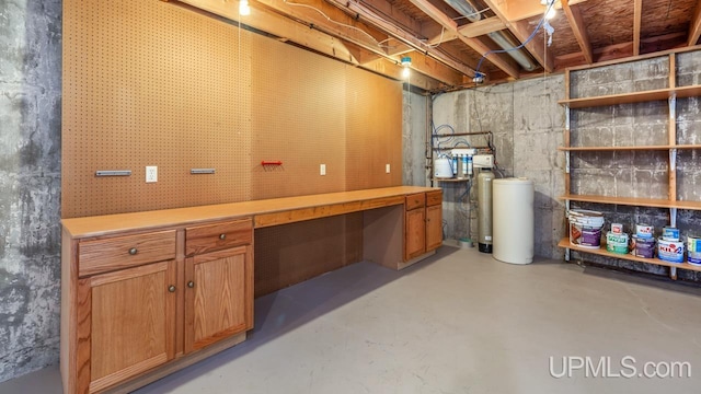 160 N Pyle Dr, Kingsford, MI 49802 - unfinished basement featuring a water softener system and a workshop area