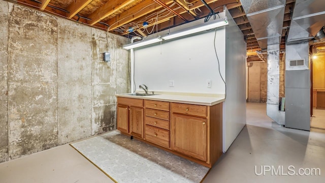 160 N Pyle Dr, Kingsford, MI 49802 - unfinished basement featuring a sink