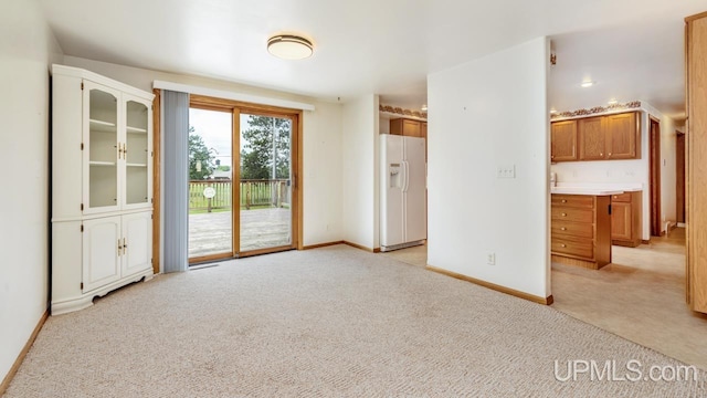 160 N Pyle Dr, Kingsford, MI 49802 - unfurnished room with light colored carpet and baseboards