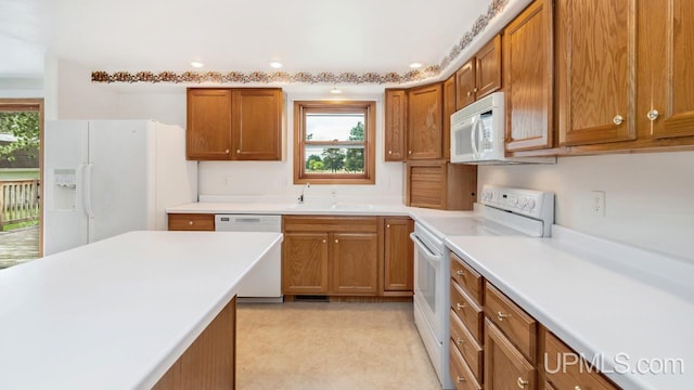 160 N Pyle Dr, Kingsford, MI 49802 - kitchen with white appliances, brown cabinets, healthy amount of natural light, and recessed lighting