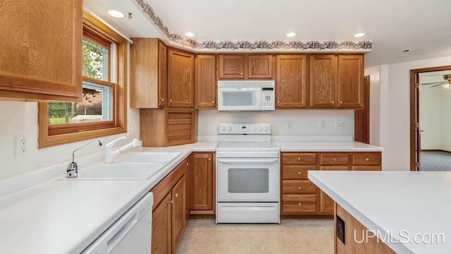 160 N Pyle Dr, Kingsford, MI 49802 - kitchen featuring white appliances, brown cabinetry, light countertops, recessed lighting, and a ceiling fan