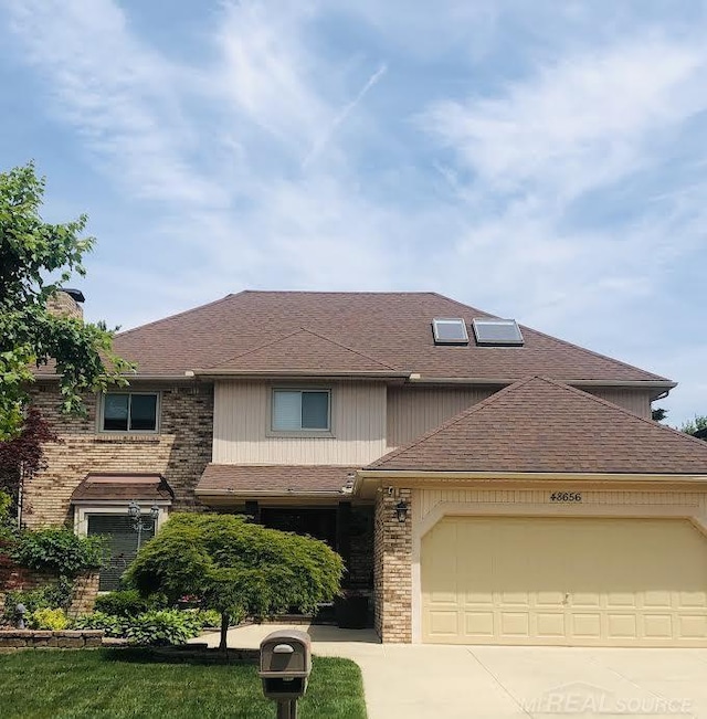 48656 Presidential Dr, Macomb Twp, MI 48044 - view of front of property with a garage, driveway, a shingled roof, brick siding, and a chimney