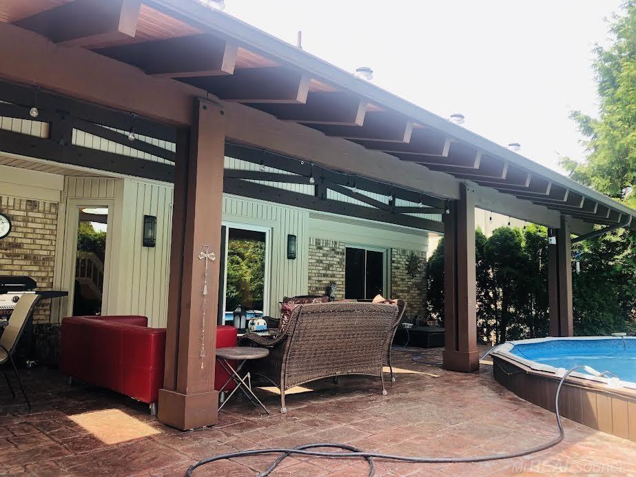 48656 Presidential Dr, Macomb Twp, MI 48044 - view of patio / terrace with a hot tub