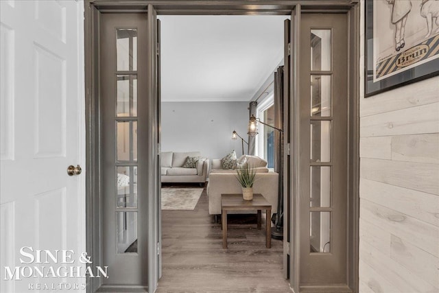 2727 Horseshoe Lake Rd, West Branch, MI 48661 - hallway featuring ornamental molding, wood finished floors, and wooden walls