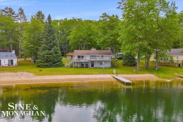 2727 Horseshoe Lake Rd, West Branch, MI 48661 - rear view of house featuring a yard and a deck with water view