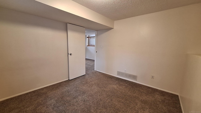 4130 Elmhurst Rd, Waterford, MI 48328 - unfurnished room with dark carpet and a textured ceiling