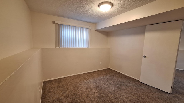 4130 Elmhurst Rd, Waterford, MI 48328 - unfurnished bedroom with a textured ceiling and carpet flooring
