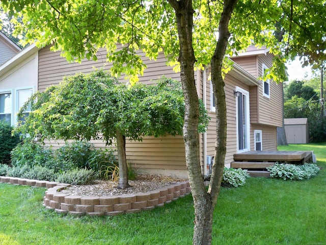 4130 Elmhurst Rd, Waterford, MI 48328 - view of home's exterior with a yard and a storage unit