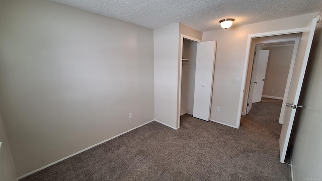 4130 Elmhurst Rd, Waterford, MI 48328 - unfurnished bedroom with dark colored carpet, a textured ceiling, and a closet