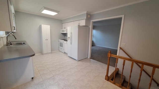 4130 Elmhurst Rd, Waterford, MI 48328 - kitchen featuring white appliances, crown molding, white cabinets, and dark countertops