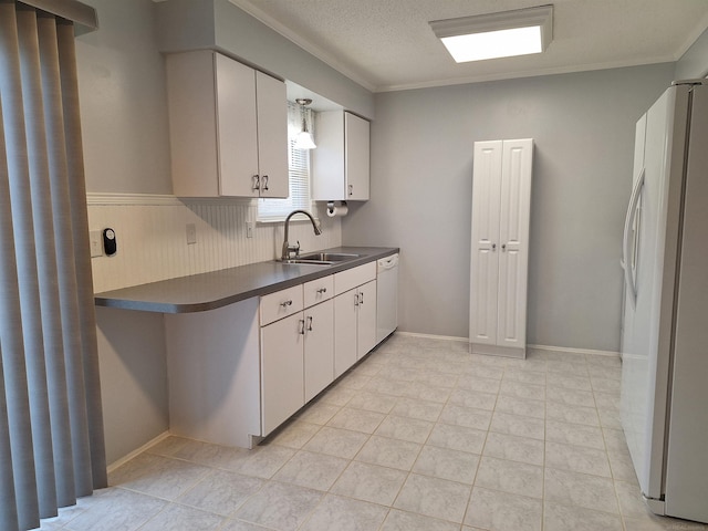 4130 Elmhurst Rd, Waterford, MI 48328 - kitchen with white appliances, ornamental molding, dark countertops, white cabinetry, and light tile patterned floors