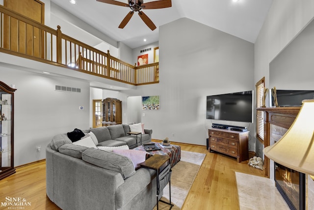 23875 Settlers Dr, Macomb Twp, MI 48042 - living area featuring high vaulted ceiling, ceiling fan, and wood finished floors