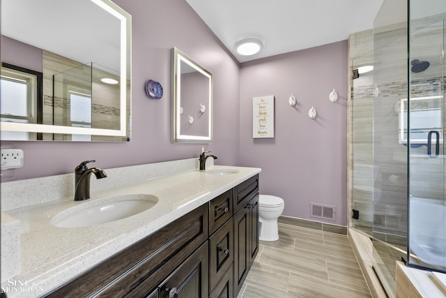 23875 Settlers Dr, Macomb Twp, MI 48042 - bathroom featuring double vanity and a stall shower