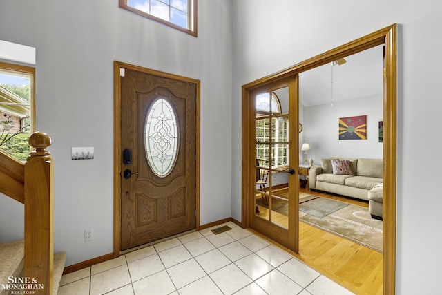 23875 Settlers Dr, Macomb Twp, MI 48042 - foyer entrance with plenty of natural light, a high ceiling, and light tile patterned floors