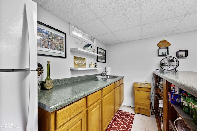 23875 Settlers Dr, Macomb Twp, MI 48042 - kitchen featuring freestanding refrigerator, a drop ceiling, light tile patterned floors, dark countertops, and open shelves