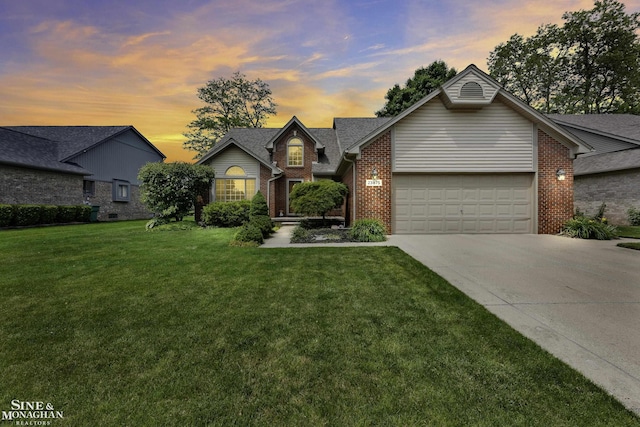 23875 Settlers Dr, Macomb Twp, MI 48042 - traditional-style home with brick siding, an attached garage, driveway, and a lawn