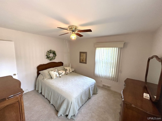 2010 Deer Lake Ave, Ishpeming, MI 49849 - bedroom with light colored carpet and ceiling fan