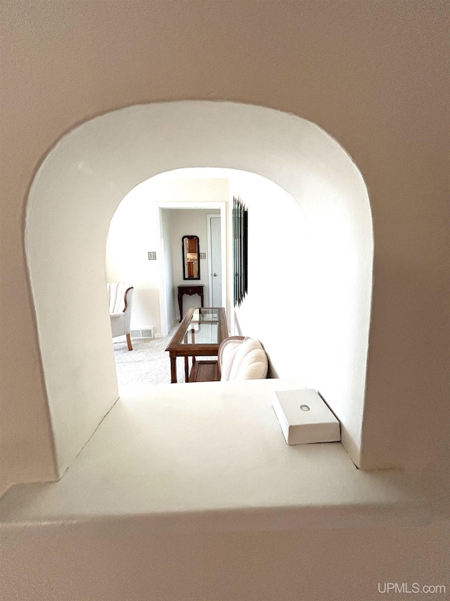 2010 Deer Lake Ave, Ishpeming, MI 49849 - hallway with arched walkways and carpet