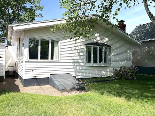 2010 Deer Lake Ave, Ishpeming, MI 49849 - view of home's exterior with a lawn