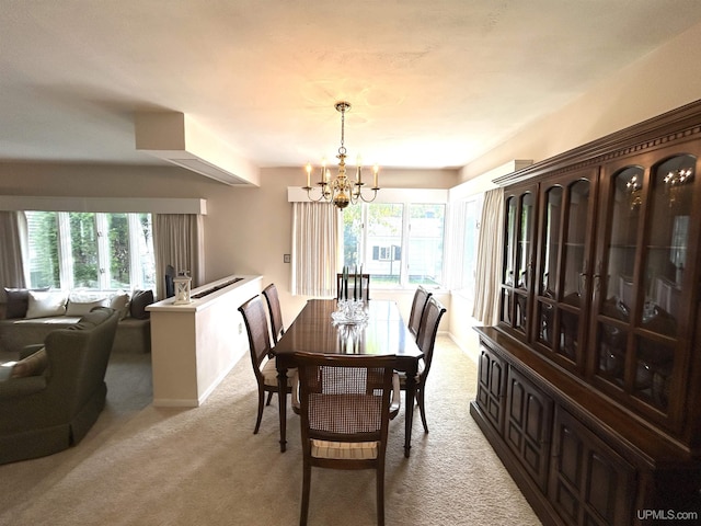 2010 Deer Lake Ave, Ishpeming, MI 49849 - dining space with light carpet and a chandelier