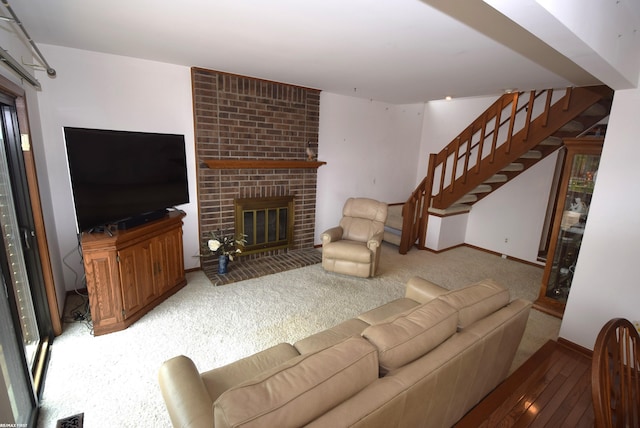 131 Cherryl Ln Unit 4, Algonac, MI 48001 - carpeted living room featuring stairs and a fireplace
